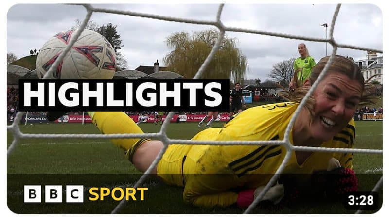 A much too close up close up from behind the goal of Mary Earps grimacing as the ball hits the net