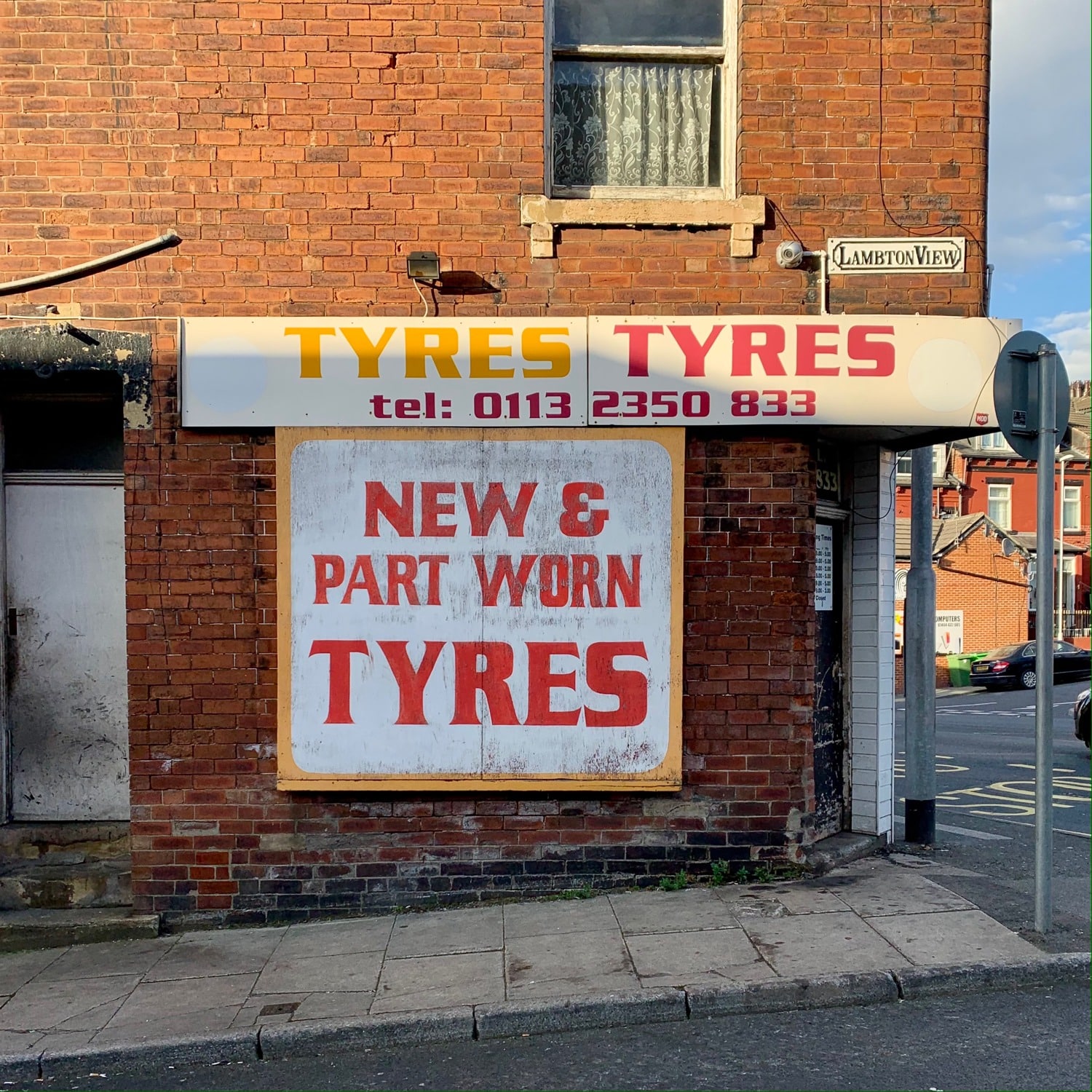 Hannah Platt's photograph, Lambton View, Leeds - 25th March 2021, showing an advert on a terrace corner for Tyres and Tyres