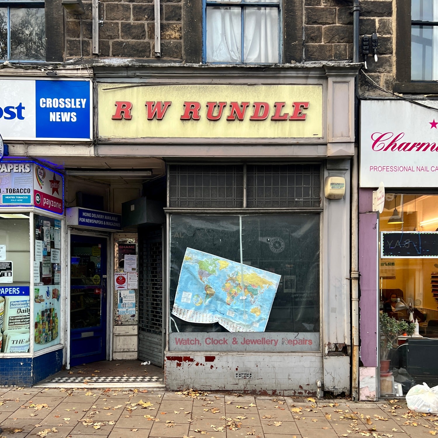 Hannah Platt's photograph, Otley Rd, Leeds - 13th November 2021, showing the shopfront of R W Rundle with its 1950s sign
