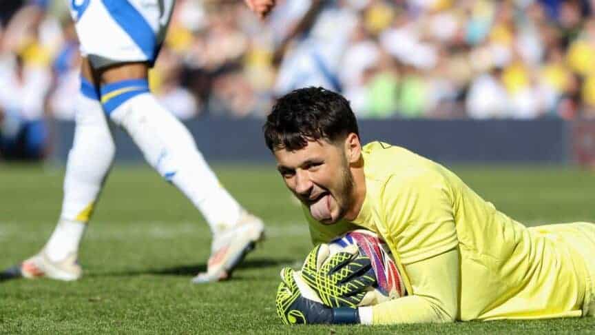 Burnley goalkeeper James Trafford lies on the floor sticking his tongue out pretending he's not a big cheat