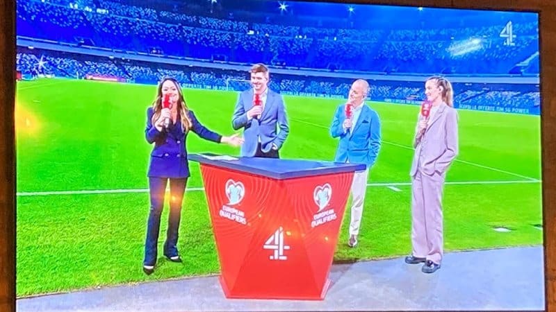 Steven Gerrard, Joe Cole, Jill Scott. Three pundits, three right hands holding mics, three left hands in trouser pockets