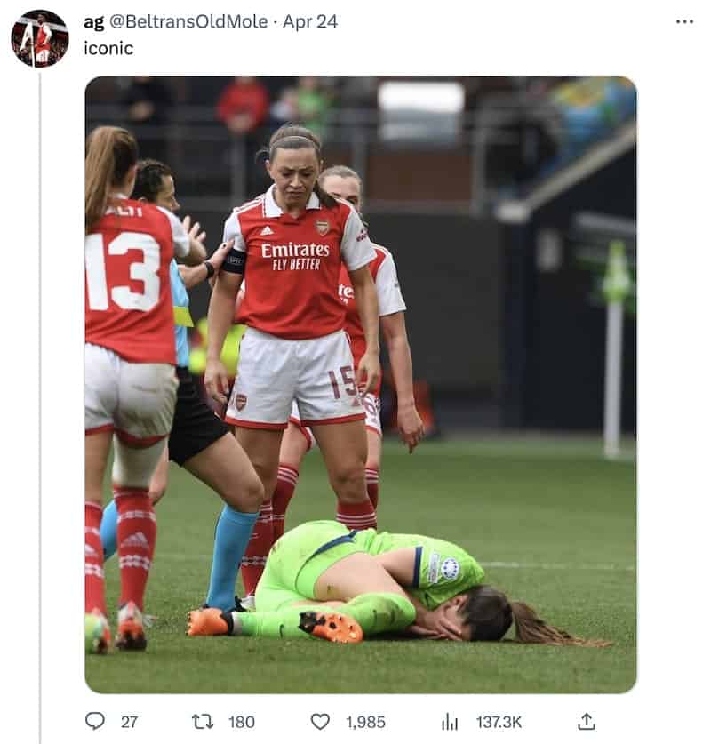 A photo of Katie McCabe, not showing much sympathy for the Wolfsburg player she's just put on the floor