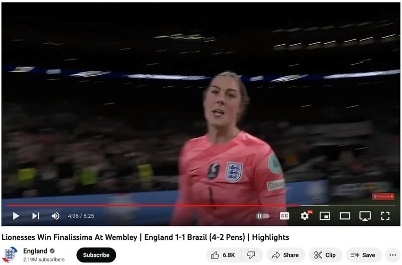 A screenshot from a YouTube video of England goalie Mary Earps going full redeemer after winning in the penalty shootout against Brazil