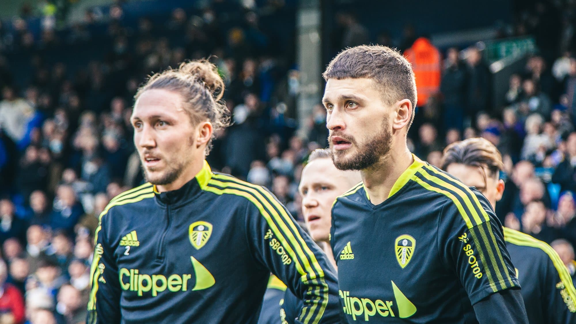 Luke Ayling and Mateusz Klich in the warmup before the Burnley game