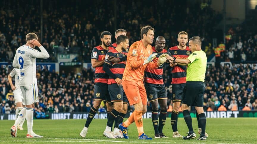 Pat Bamford turns away, scratching his ear, definitely not a nervous guilty tick, as over his shoulder the QPR players and Begovic are crowding the referee. Nothing to do with Patrick, clearly!