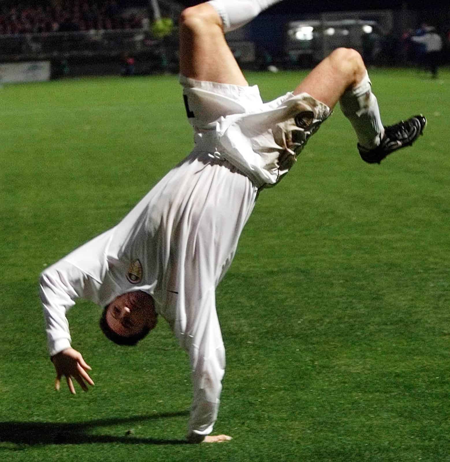 Robbie Keane celebrating his goal against Troyes with a trademark cartwheel. He's captured fully upside down in this photo