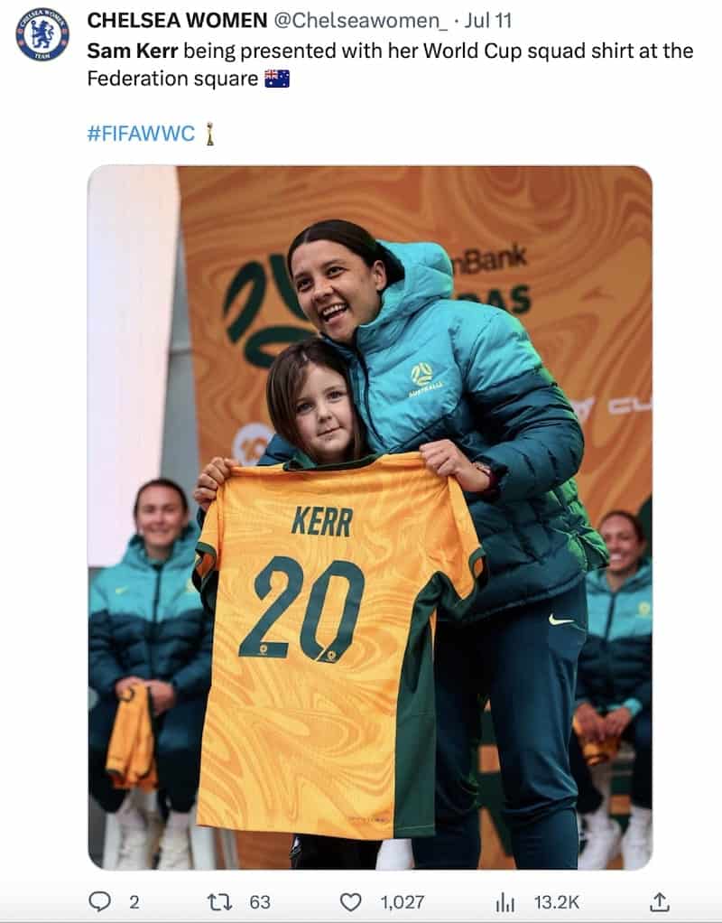 Sam Kerr cuddles a child