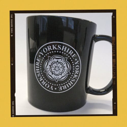 A photo of our black Yorkshire design mugs