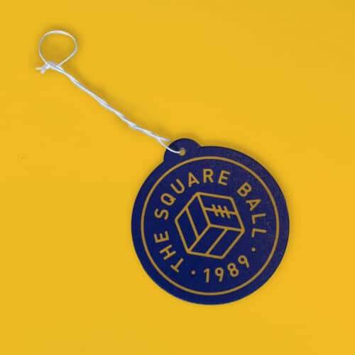 A picture of a TSB air freshener, featuring the TSB logo in blue and yellow