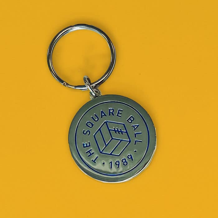 A picture of a TSB keyring, featuring the TSB logo in blue on silver enamel