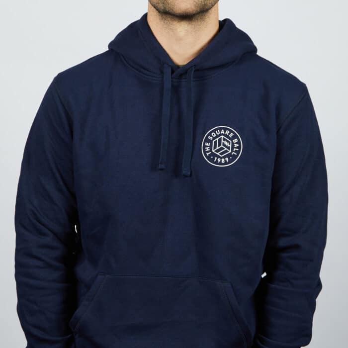 Our Michael wearing a TSB pocket logo hoodie in navy