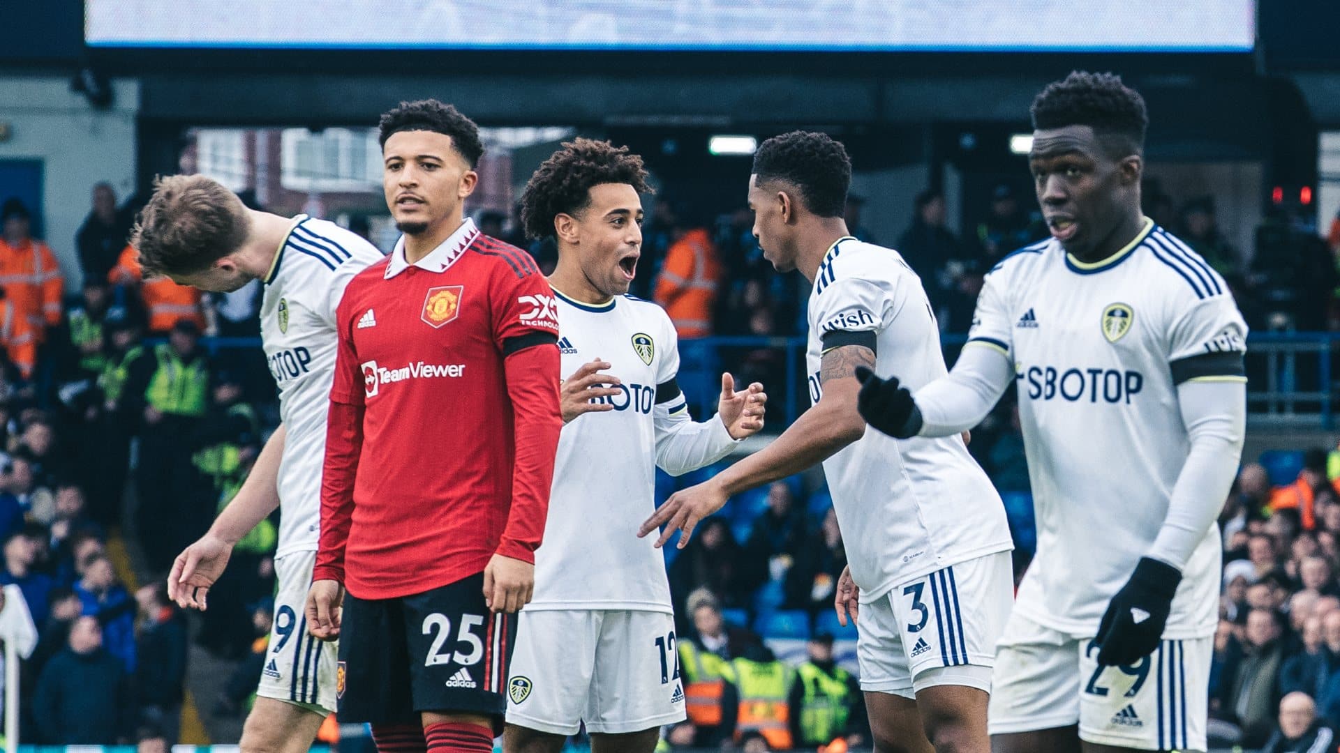 Tyler Adams looks shocked by a joke Junior Firpo has just told him. They're supposed to be taking a free-kick so maybe Firps just suggested shooting or something