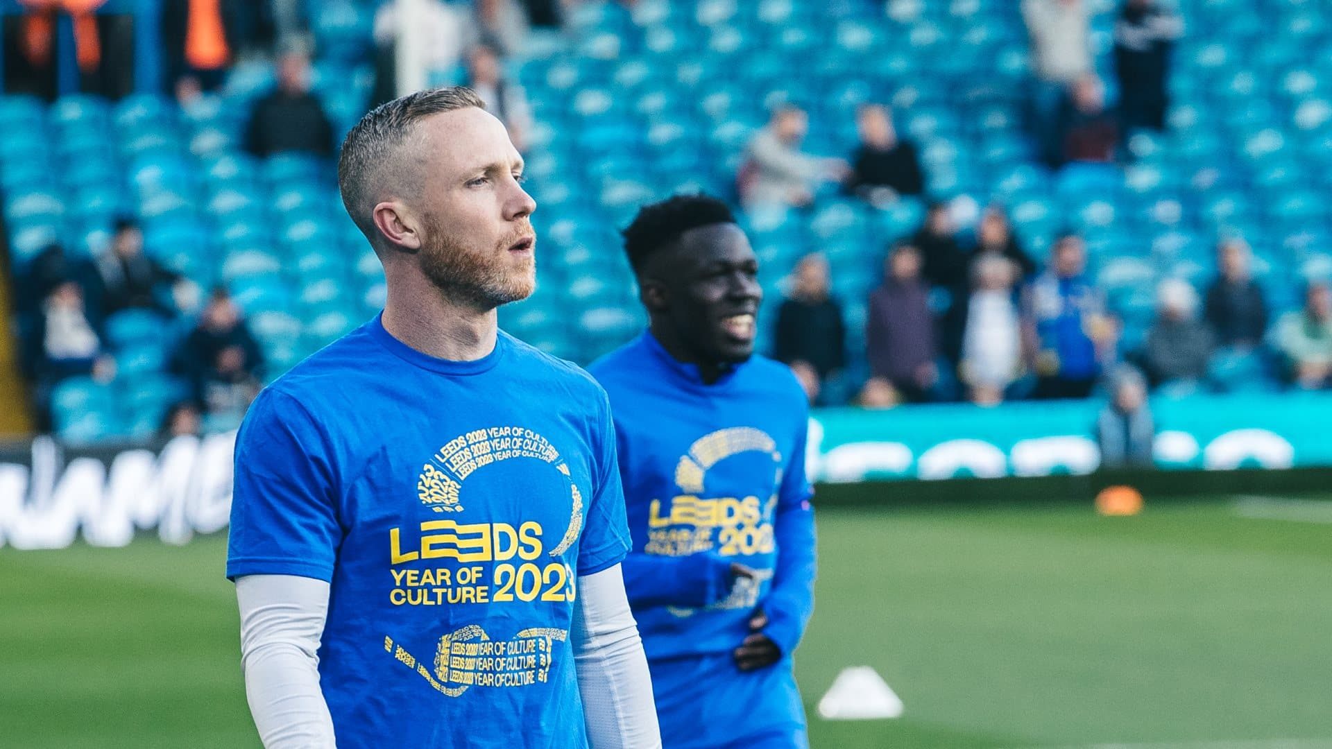 Adam Forshaw warming up in a Leeds City of Culture t-shirt, because he is more cultured a midfielder than Weston McKennie and the gang could ever hope to be