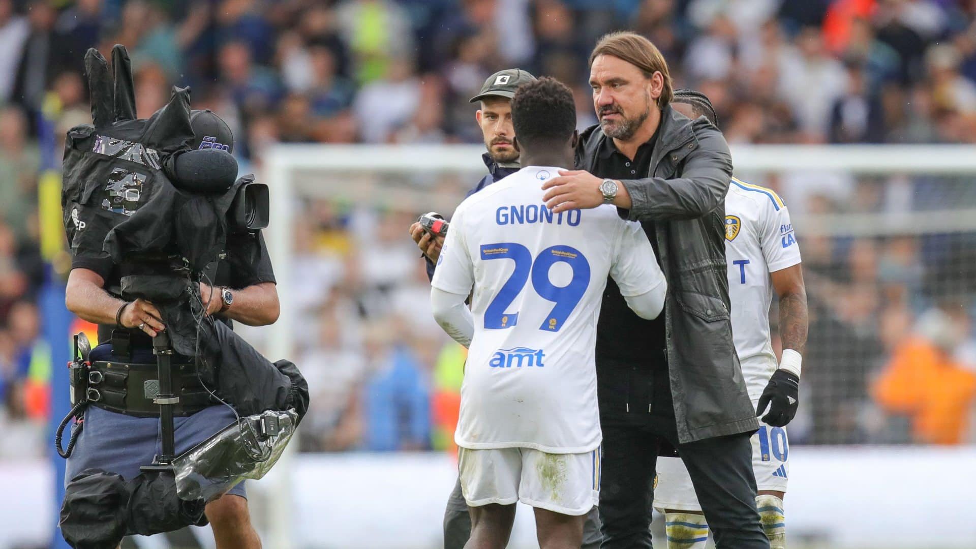 Daniel Farke moving to either hug Wilf Gnonto or strangle him, as a camera moves in from the side at the end of the Leeds vs Cardiff game