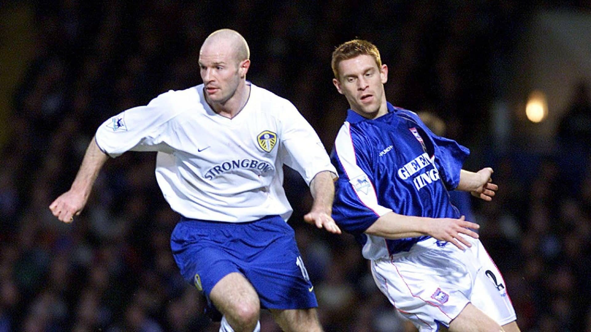 Danny Mills (white shirt, blue shorts) protecting the ball from Richard Naylor (blue shirt, white shorts) at Portman Road in 2001