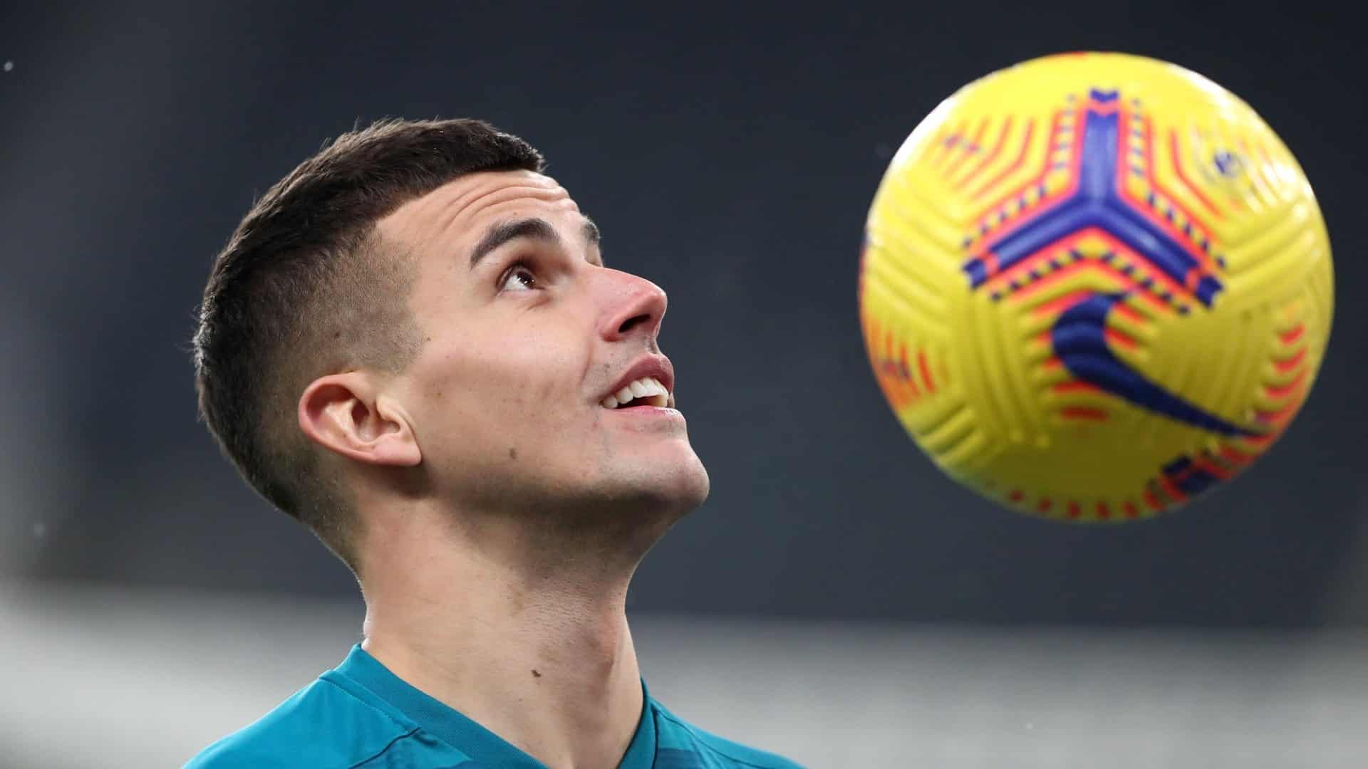 Karl Darlow's head in profile, with a size five football next to it floating in the air
