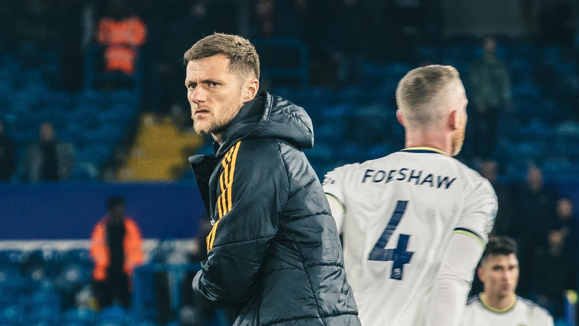 Liam Cooper on the pitch at the end of the Liverpool game, with a face like a ruined holiday