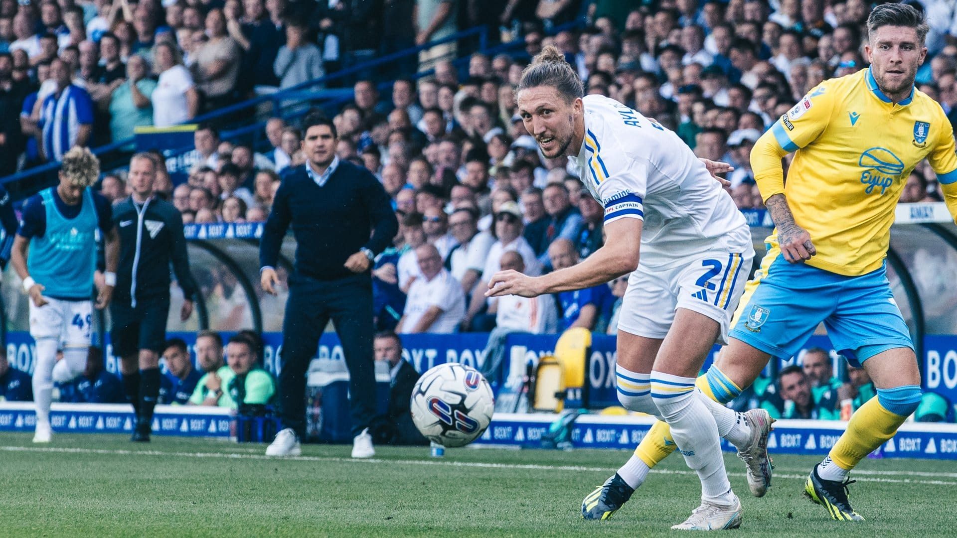 Luke Ayling going after the ball during the game against Sheffield Wednesday, his eyes on it very intently