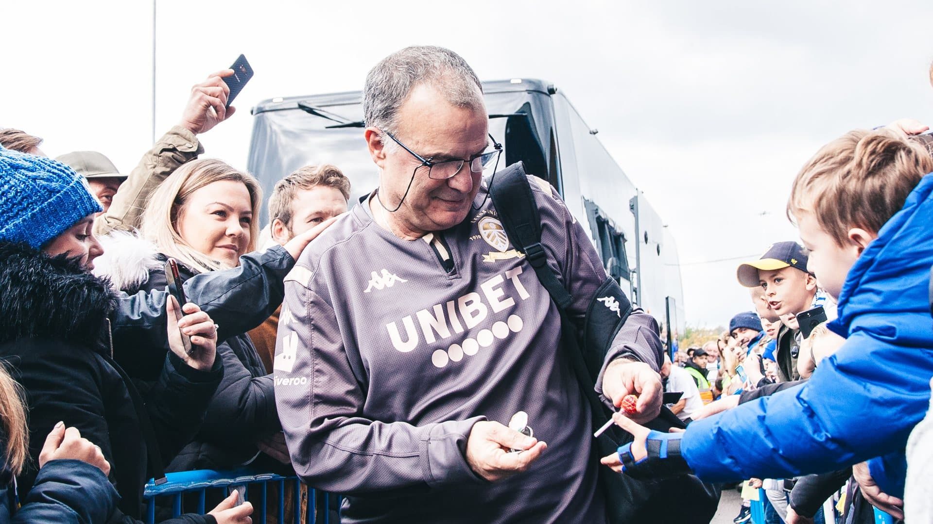 Marcelo Bielsa, arriving at Elland Road for the Centenary Game in 2019, handing out actual lollipops to kids