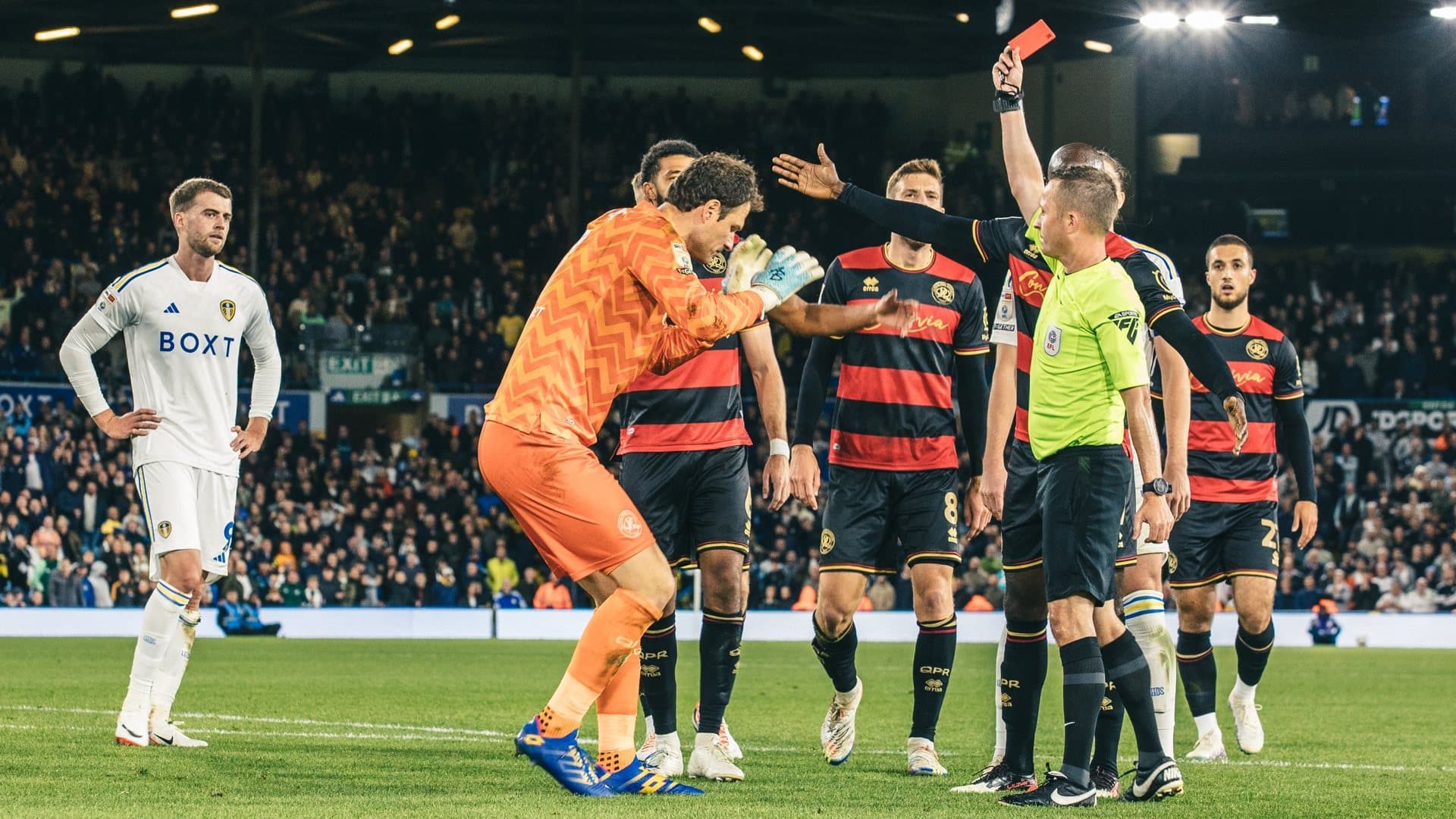 Pat Bamford looks on in no way guiltily as QPR players crowd the ref who is showing Begovic a red card that, again, was in no way Bamford's fault, you can tell by how honest he looks can't you