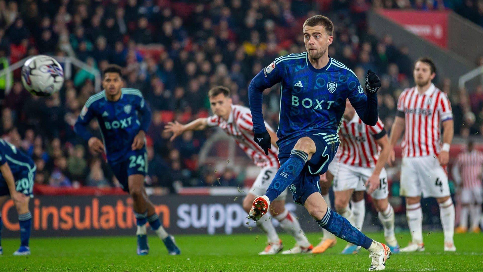 Pat Bamford in the blue peacock print kit at Stoke, having a little try at taking a penalty, while Stoke's Ben Pearson lurks
