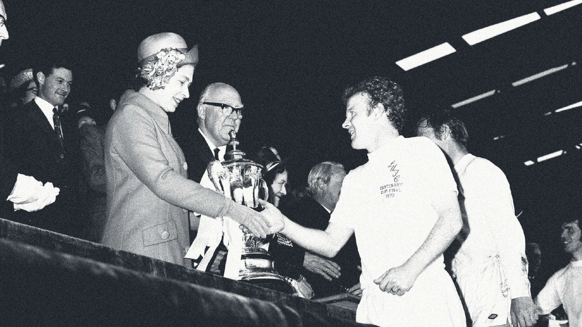 An image of Billy Bremner shaking the Queen's hand as he receives the FA Cup following the 1972 final