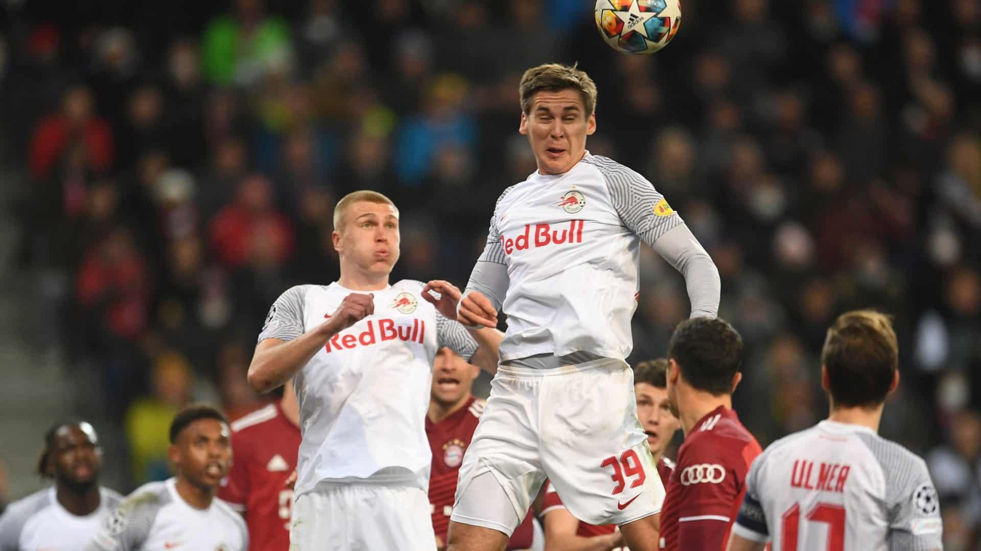 Rasmus Kristensen and Maxi Wober challenging for an aerial ball at their old, taurine obsessed club. They're wearing all white kits with 'Red Bull' across the chest, so maybe if you squint into an alternate reality... actually let's not go there