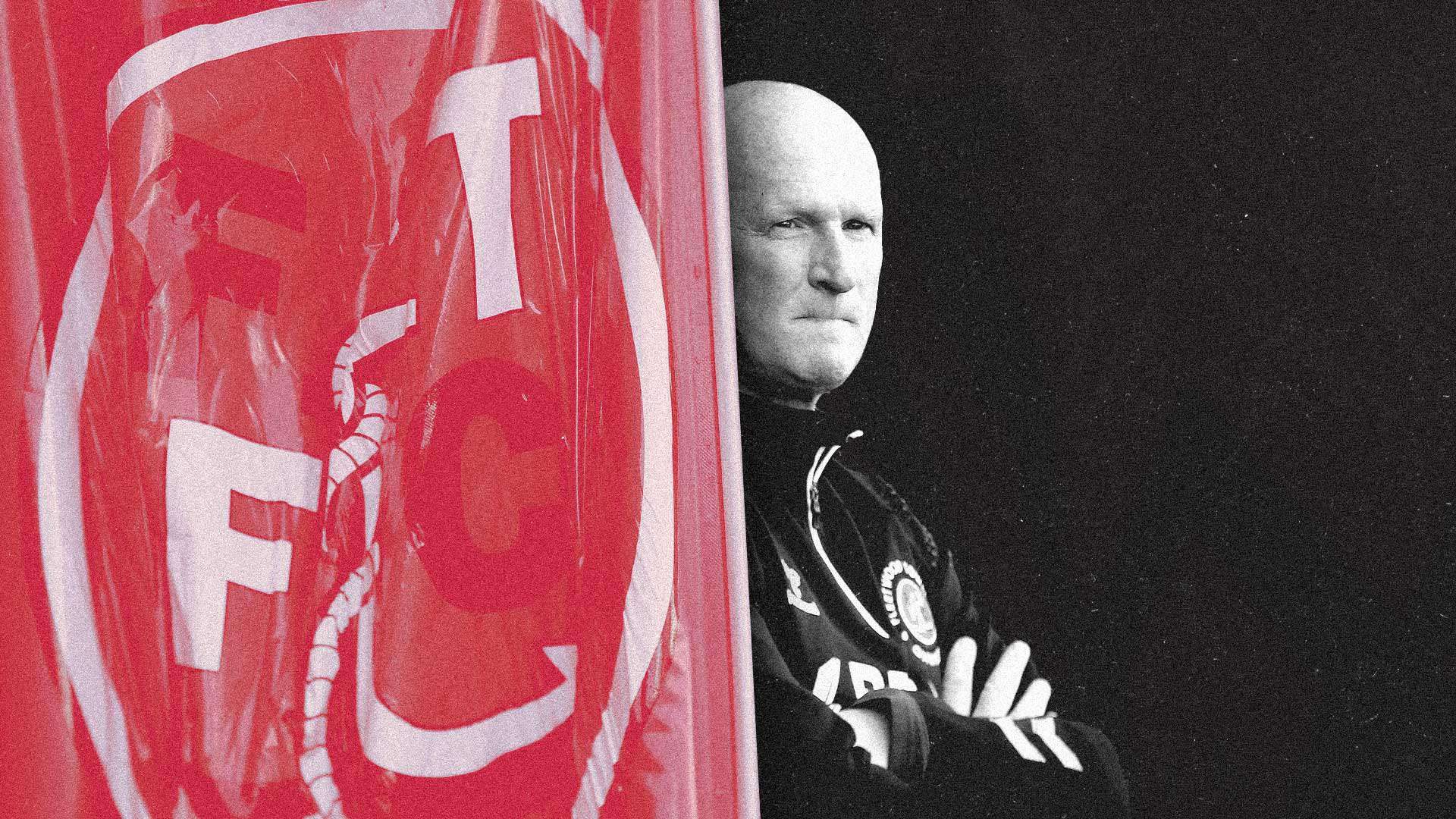 Smooth-headed Simon Grayson looking pensively at the pitch at Fleetwood