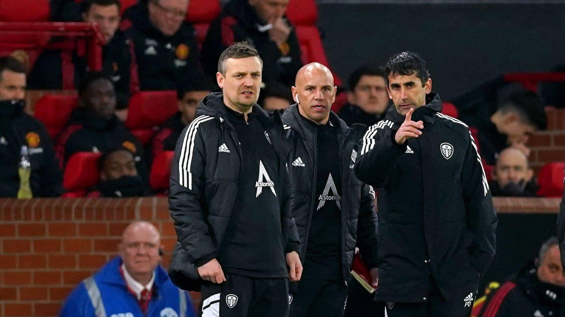 Michael Skubala, Chris Armas and Paco Gallardo doing some top class pointing and discussing on the touchline at Old Trafford