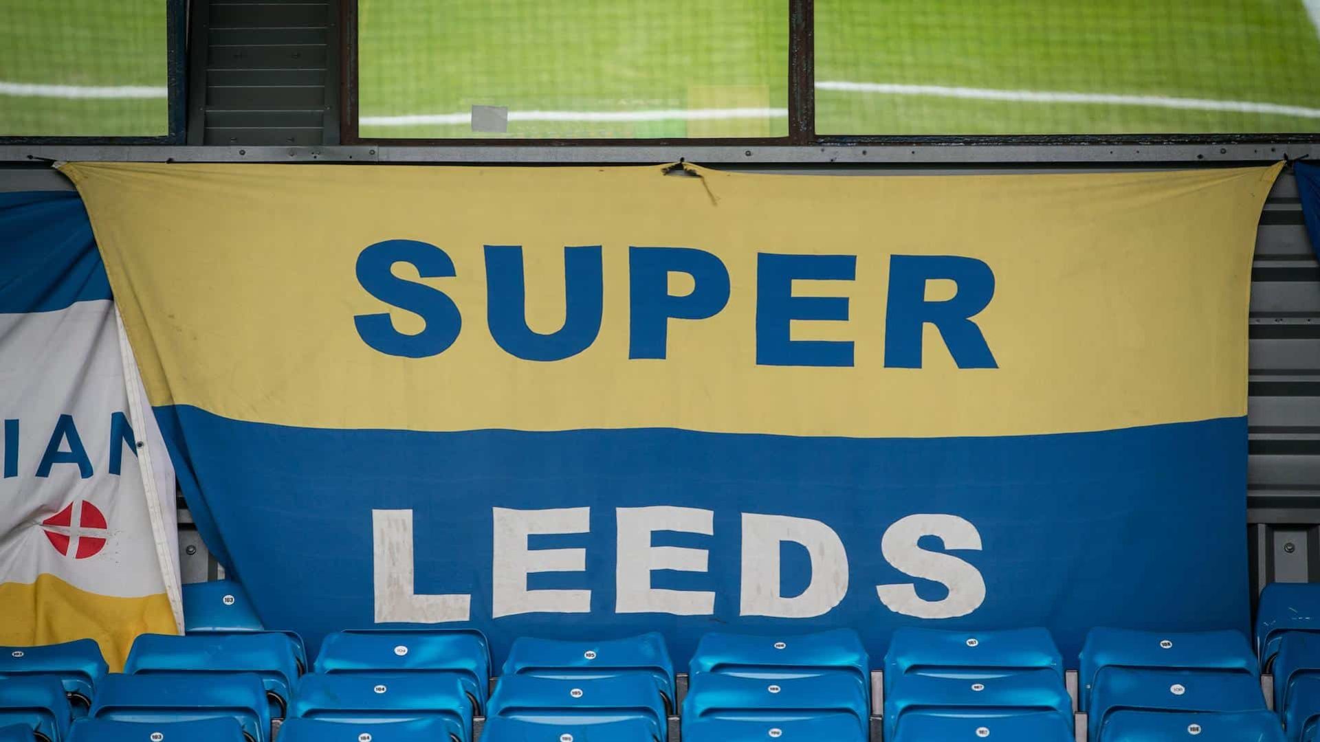 A photo of a Super Leeds flag hanging in an empty south stand