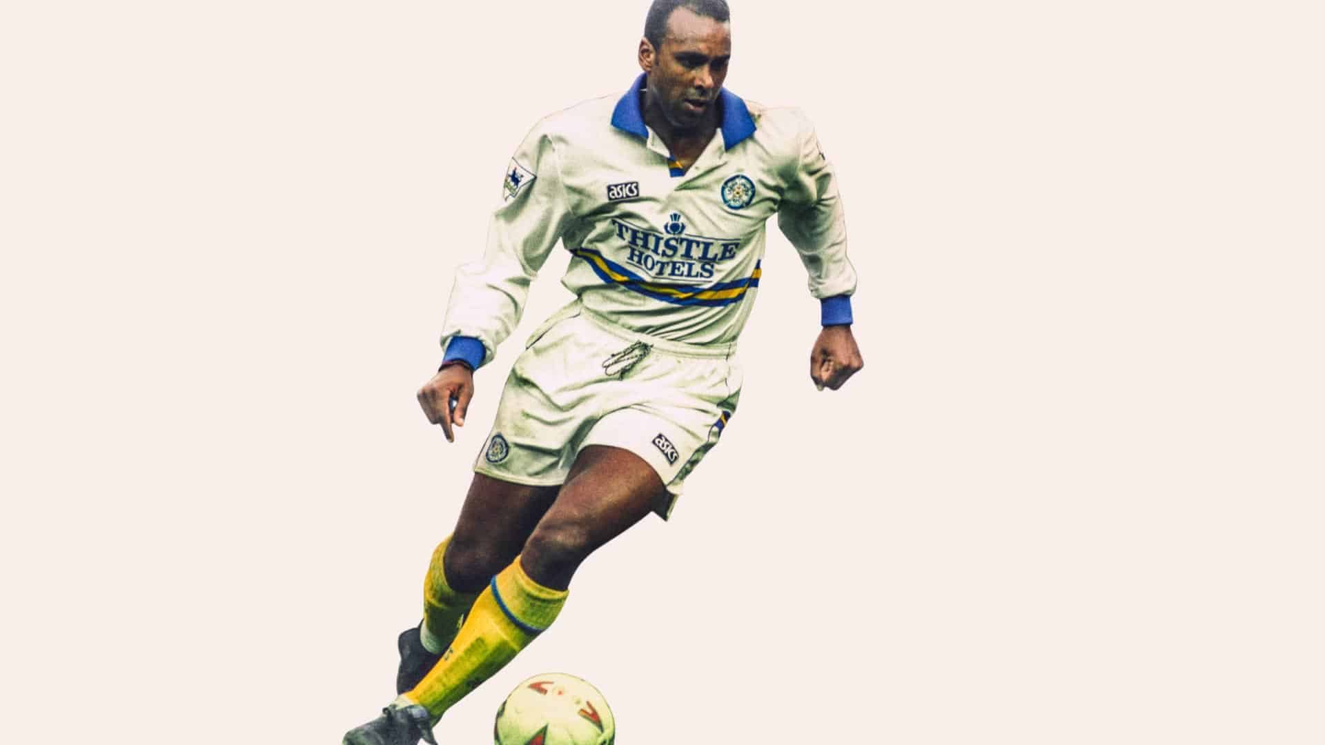 A photo of David Rocastle in Leeds United's 1993/94 Thistle Hotels-sponsored home kit