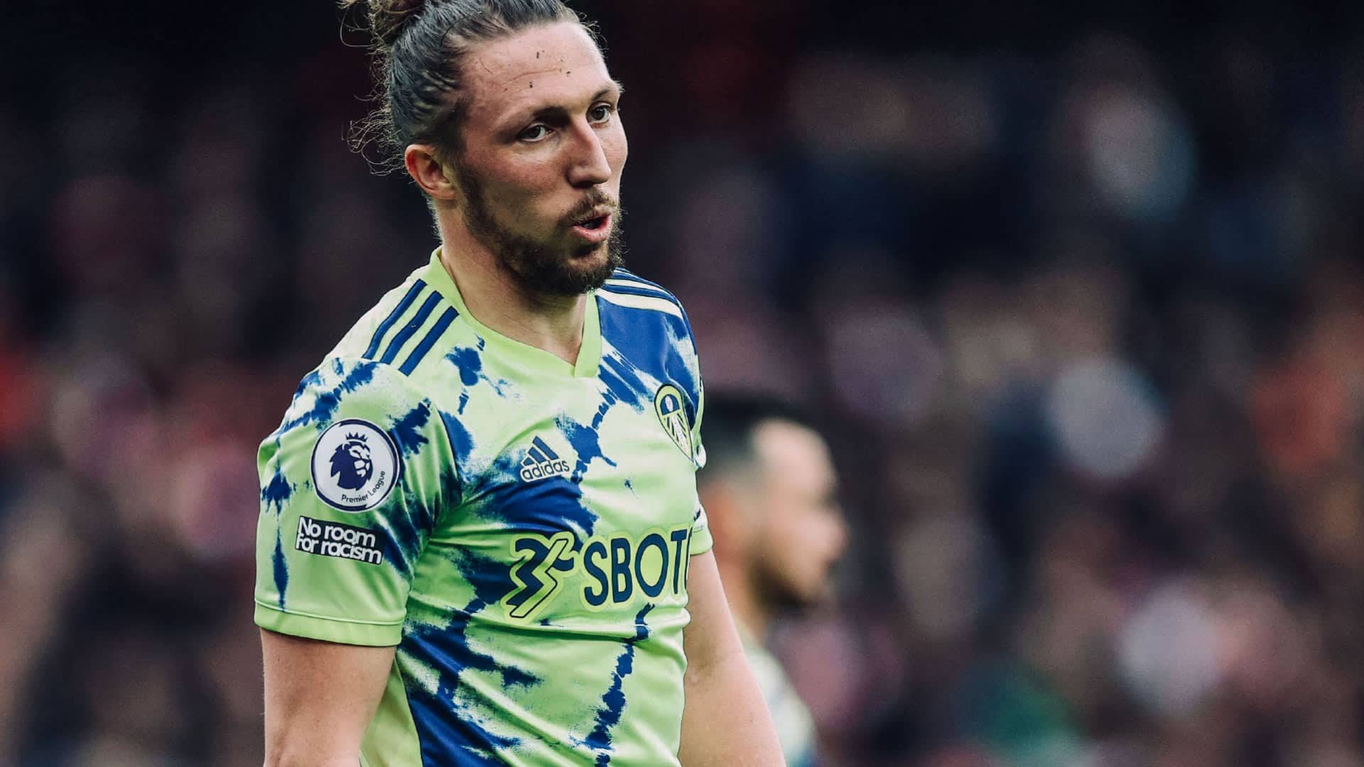 A photograph of Luke Ayling in Leeds' disco-stilton away kit