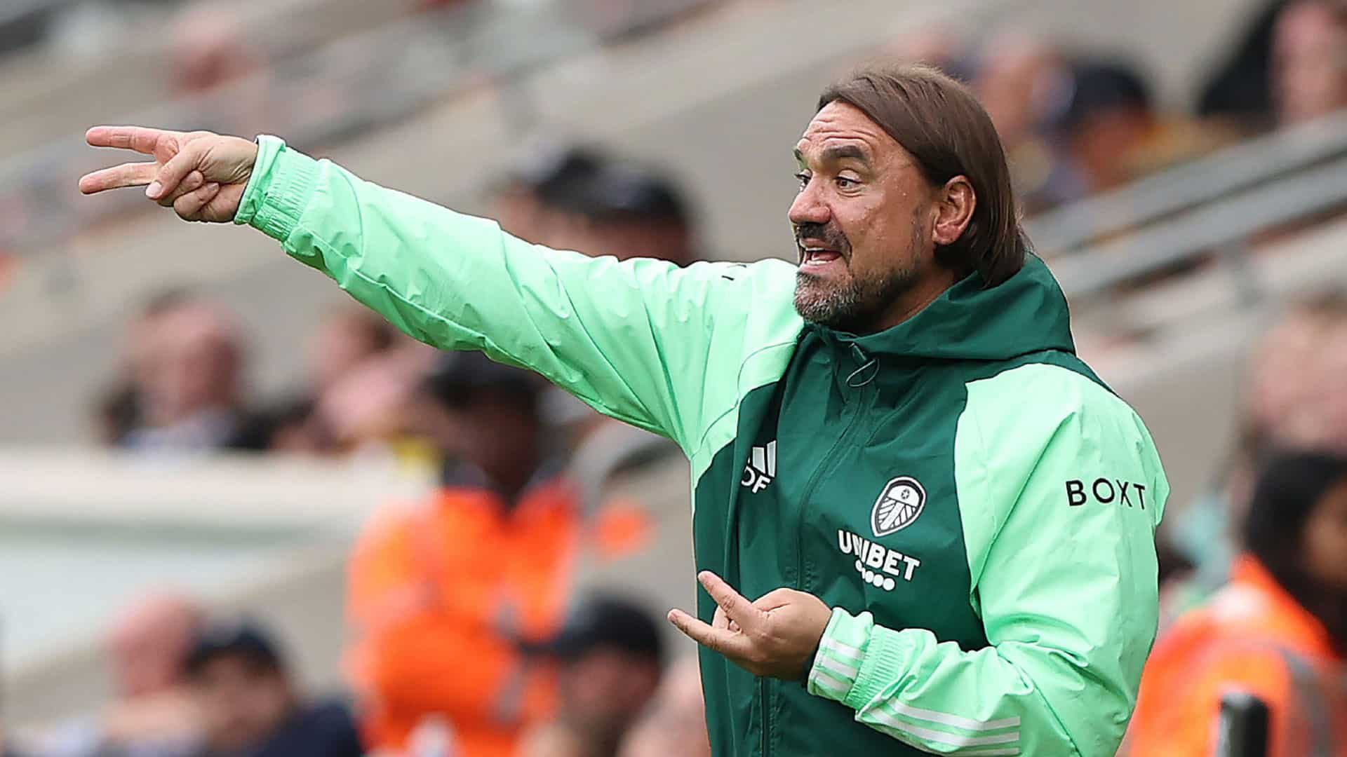 A photo of Daniel Farke in a mint green LUFC training jacket, giving instructions to his players