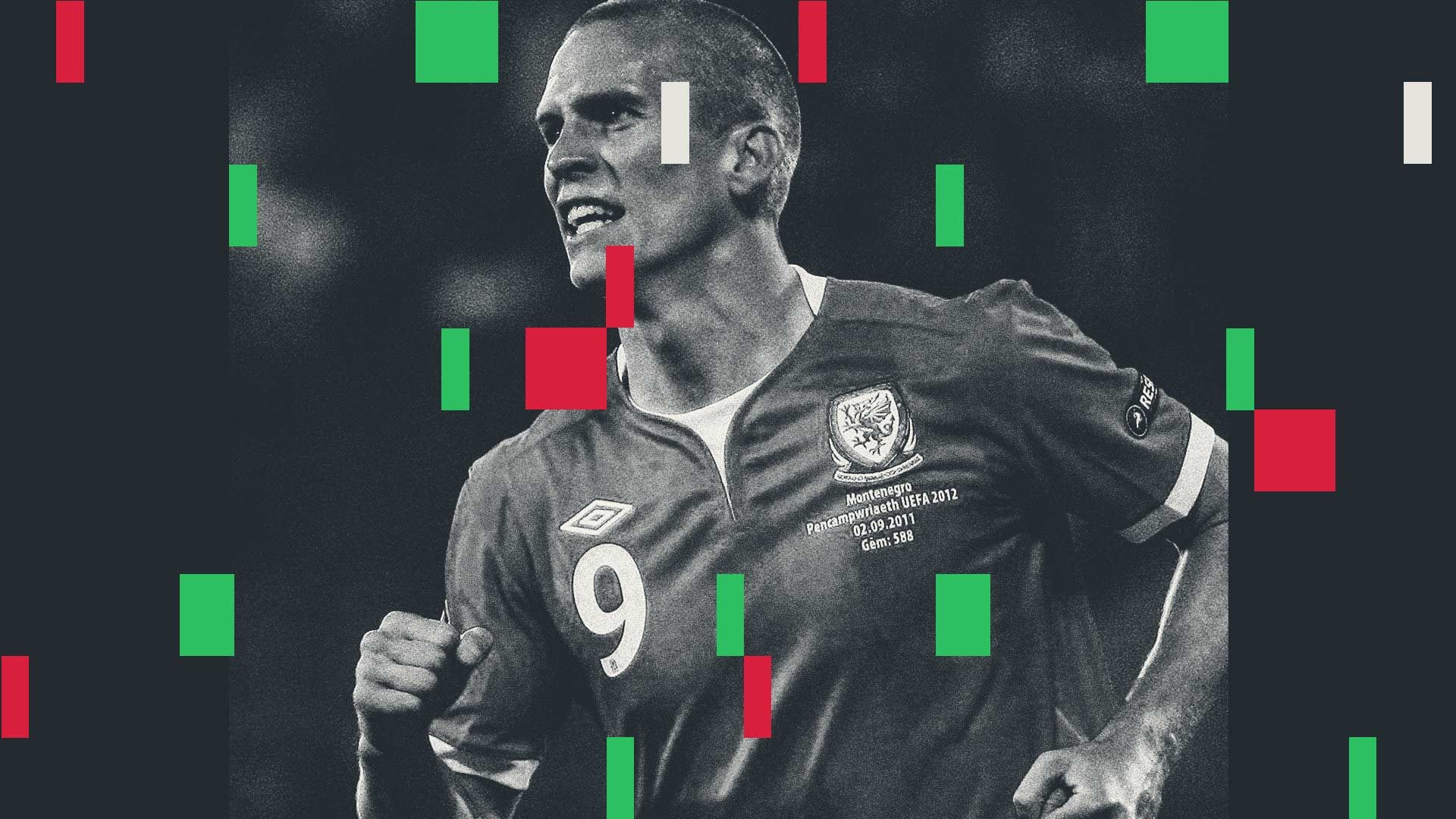 Steve Morison playing for Wales during a particularly fallow period of the national team. I can't tell if it's a black and white photo or he's just drained the life out of the atmosphere around him