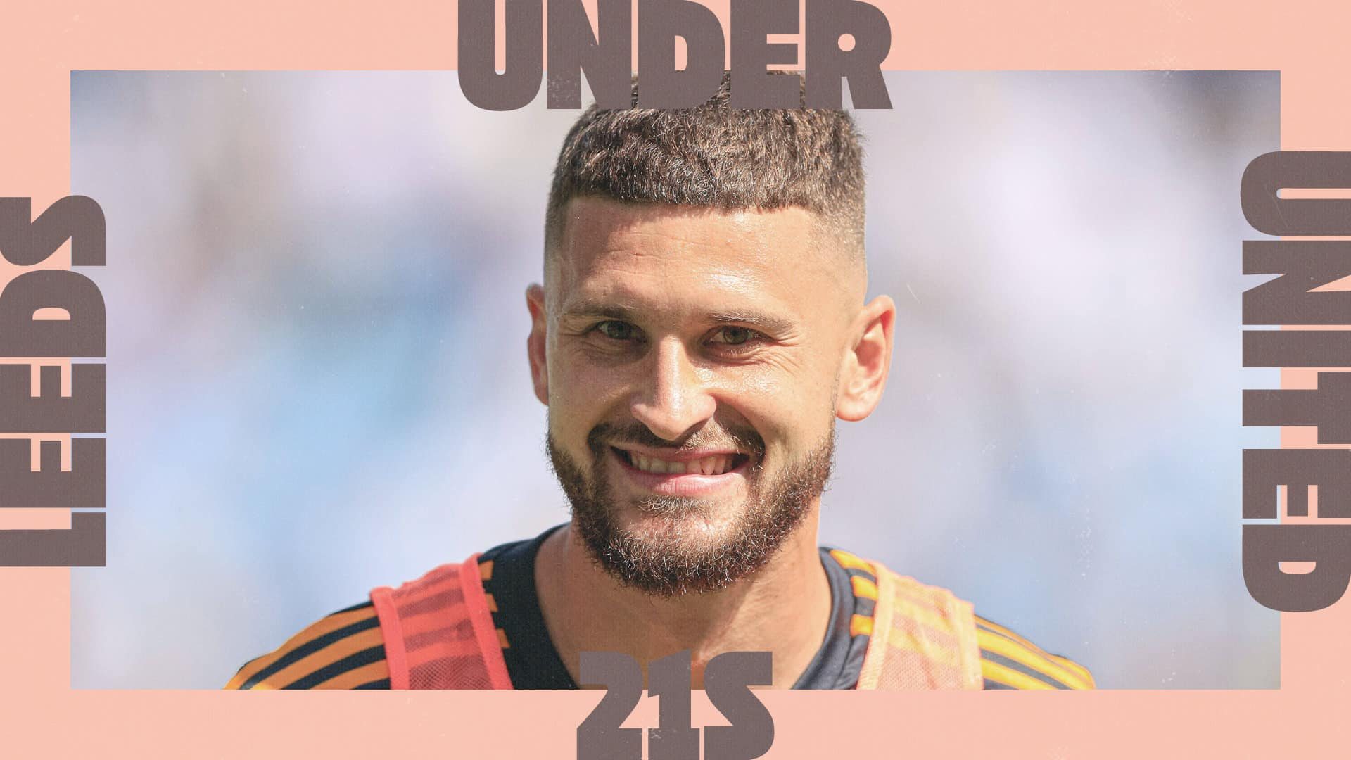 Mateusz Klich, grinning his grin, in the middle of a fancy pink border with the words 'Leeds United 21s'