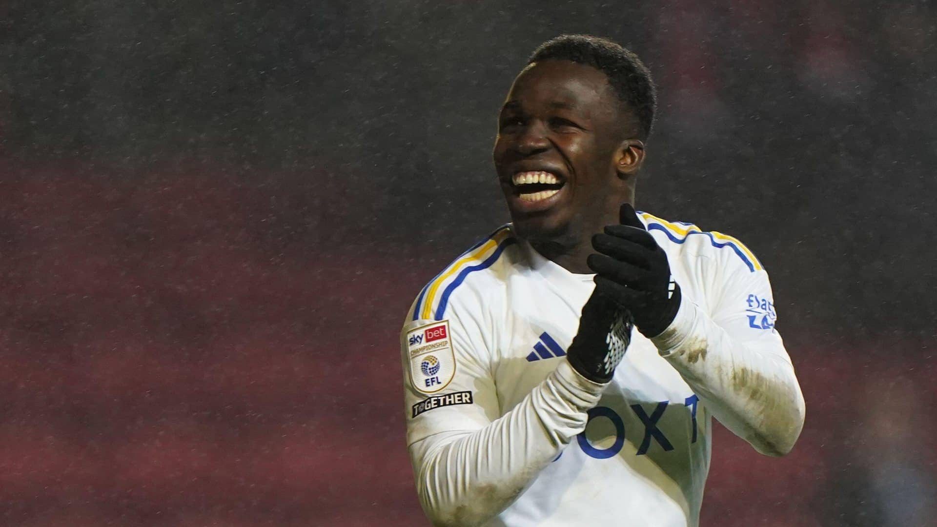 Wilf Gnonto clapping his hands and grinning at the crowd at Ashton Gate