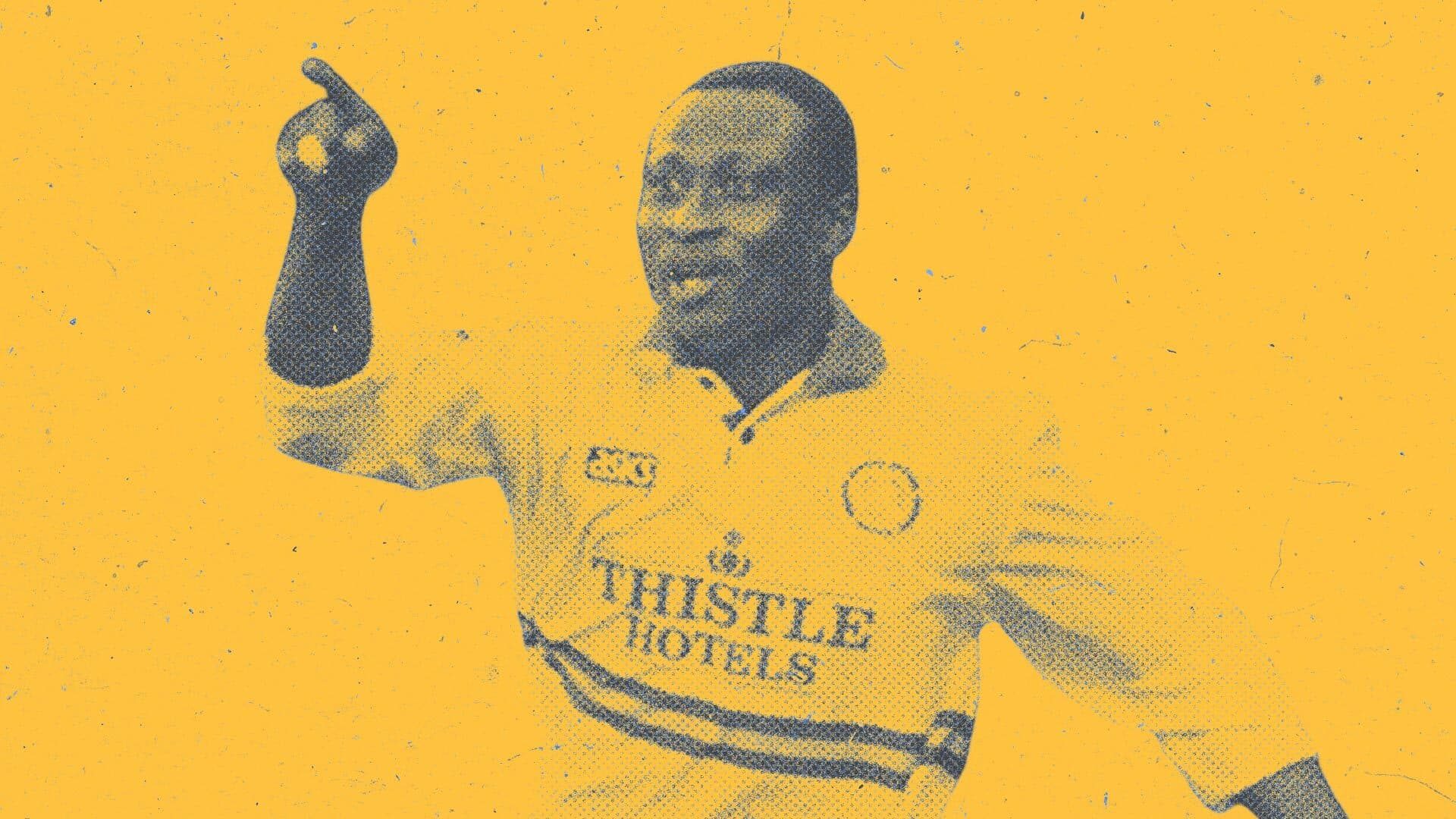 Tony Yeboah celebrating in the white Thistle Hotels kit, pointing — towards Europe