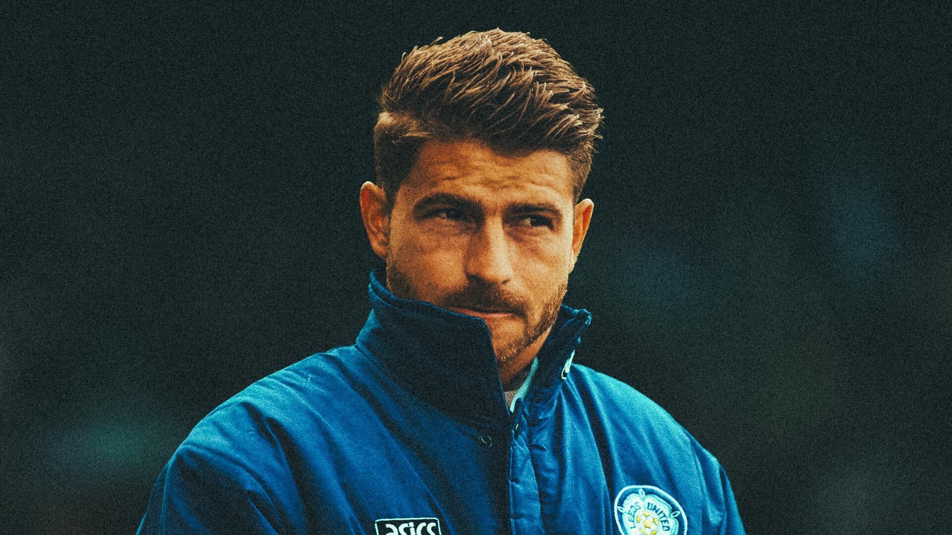 Gaetano Berardi looking, quite frankly, fucking ridiculously handsome, photoshopped in an old school LUFC coach's jacket