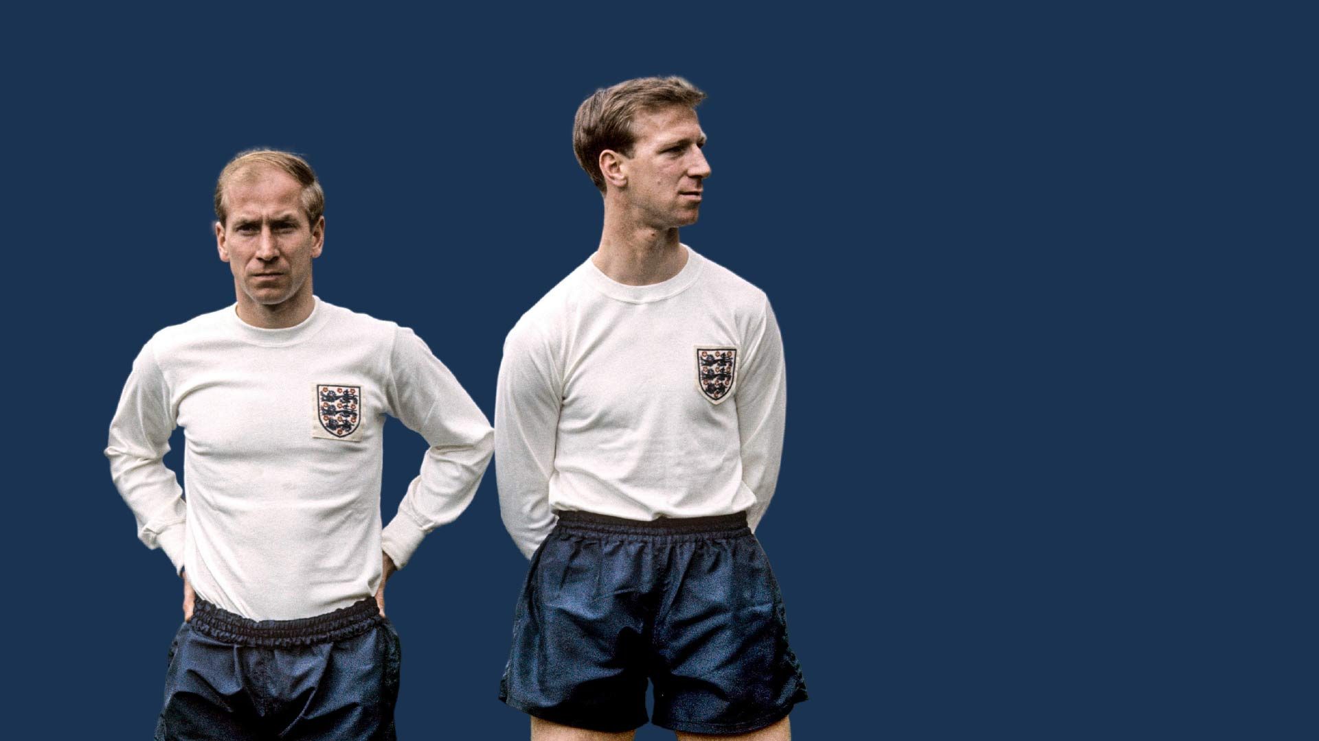 Bobby and Jack Charlton standing next to each other in England kits. Jack looks cooler