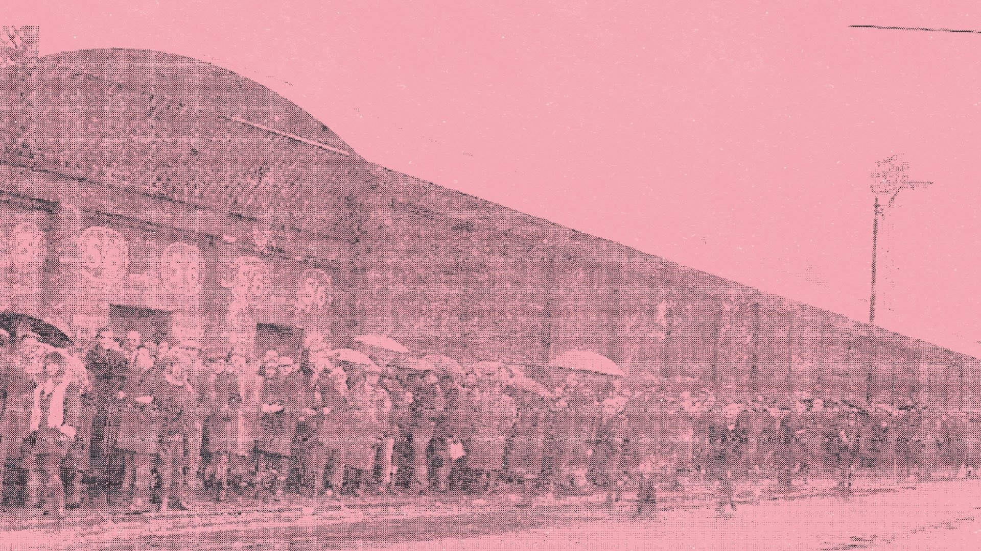 Fans queuing at Elland Road for the 1910 FA Cup semi-final between Barnsley and Everton. Lots of them are using umbrellas, because it's Leeds